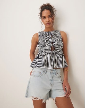 shirred top with peplum and front bows in navy white stripe