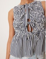 shirred top with peplum and front bows in navy white stripe